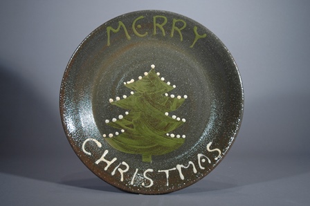 John Chalke and Barbara Tipton. Merry Christmas Plate, not dated. Earthenware, stenciled, trailed slip, handpainted, 27.9 x 5.1 cm. Photo: Barbara Tipton.