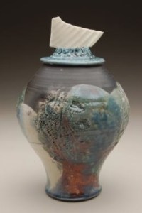 Carol Smeraldo. DATE? Ocean I. Covered (RAKU?) Jar with translucent porcelain fragment on sculptured lid. Carved and stretched. 21.5 x 15.2 cm. Photo: Stephen Hill, Center Street Clay, Chicago.