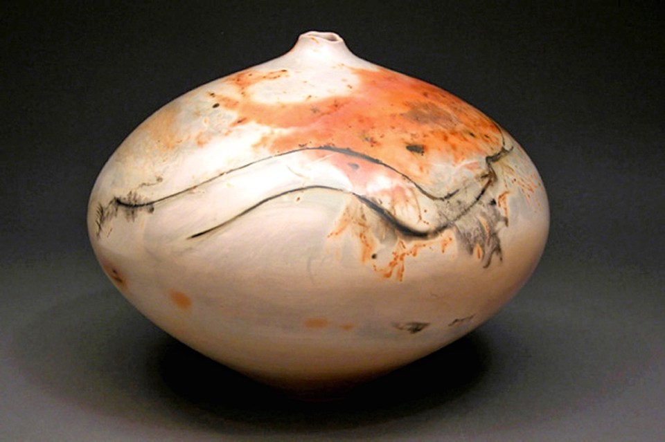 Judy Blake. Saggar fired Vessel, 2005. 30 cm h x 28 cm w. White earthenware. This piece shows the lines from the ‘fuming’ of the copper wire on the shoulder.