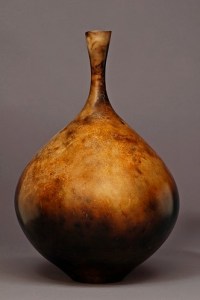 Judy Blake. Smoke-Fired Vase, 2012. Burnished, unglaHudy Blake. Saggar- and sawdust-fired vessel, 2012 White earthenware fired with straw, sawdust and newspaper, 35 cm h x 24 cm w. zed, Earthenware. 35.6 cm h x 24.1 cm w.