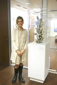 Susan Collett at Canada House next to her work from her Maze Series, Axis ll. approx. 76.2 cm high.