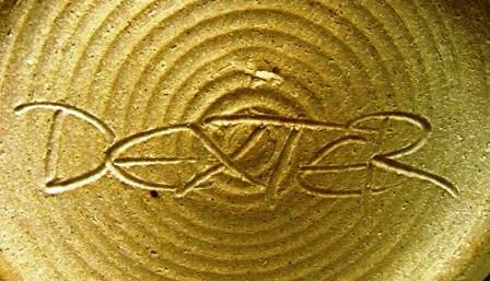 Dexter signature incised