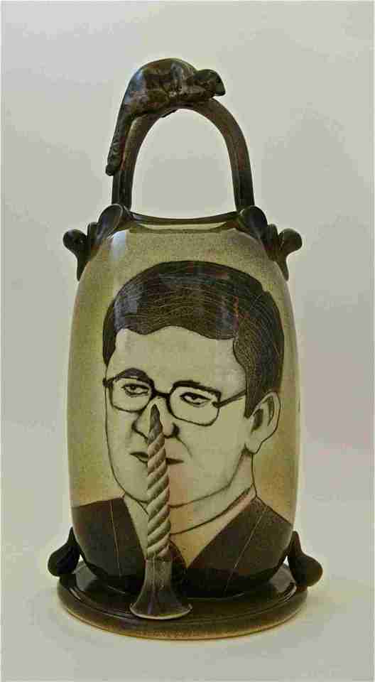 Keith Campbell. Canada's Pinocchio, with a Twist. C/6 Porcelain thrown altered, airbrush stain, sqraffito, drawn. 31 cm H x 17 cm W x 15 cm D.