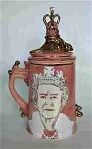Keith Campbell. 2012. "She Would Not Be Amused". Thrown porcelain stein with lid, sculpted, handbuilt, photo stencil image, drawn and airbrushed, pink stain with a clear glaze over and fired to C/6. Gold lustre fired ti C/018. It is 22 cm tall.