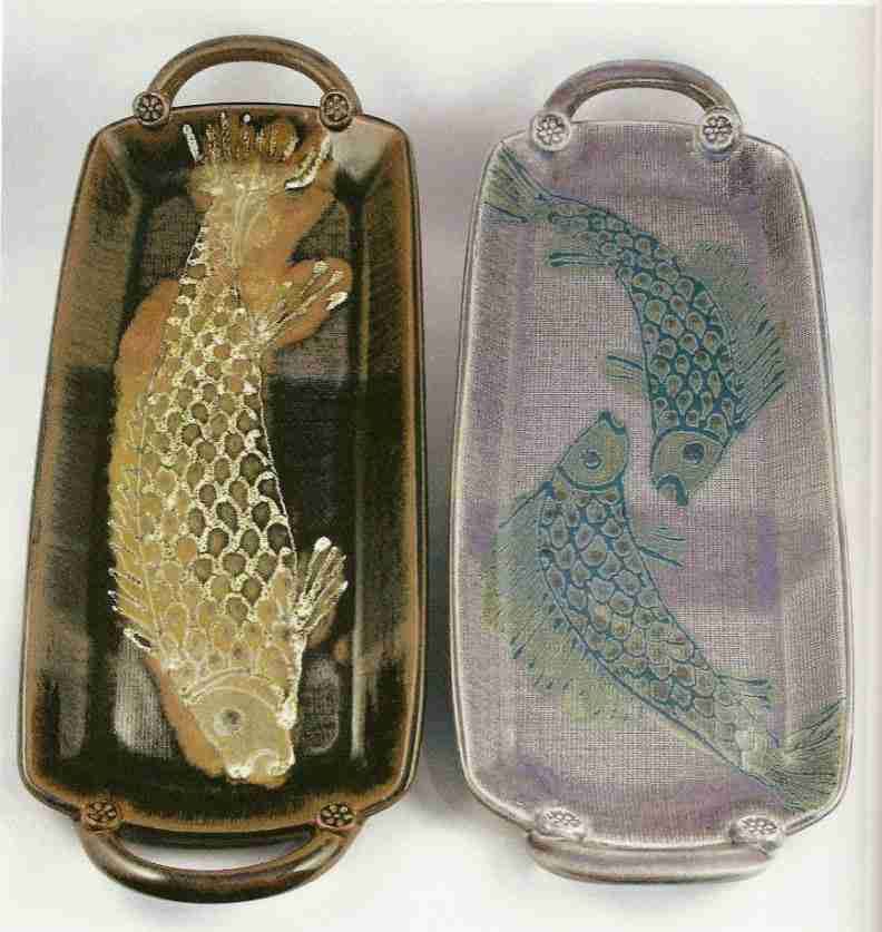 Robin Hopper. Two Salmon Plates. 2005.Press moulded. Left: tenmoku glaze variation; Right: rutile blue glaze variation. Glaze trailing and brushwork. 50.8 long x 20.3 wide x 5.1 cm high.