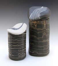 Robin Hopper. Lidded jars, Core Sample series. 1986/7. Facetted, Three- Colored Porcelain Agateware, white, blue and black; glazed inside, unglazed outside. Electric-fired at cone 8. Height of the larger jar is 25.4 cm. Photo: Judi Dyelle.