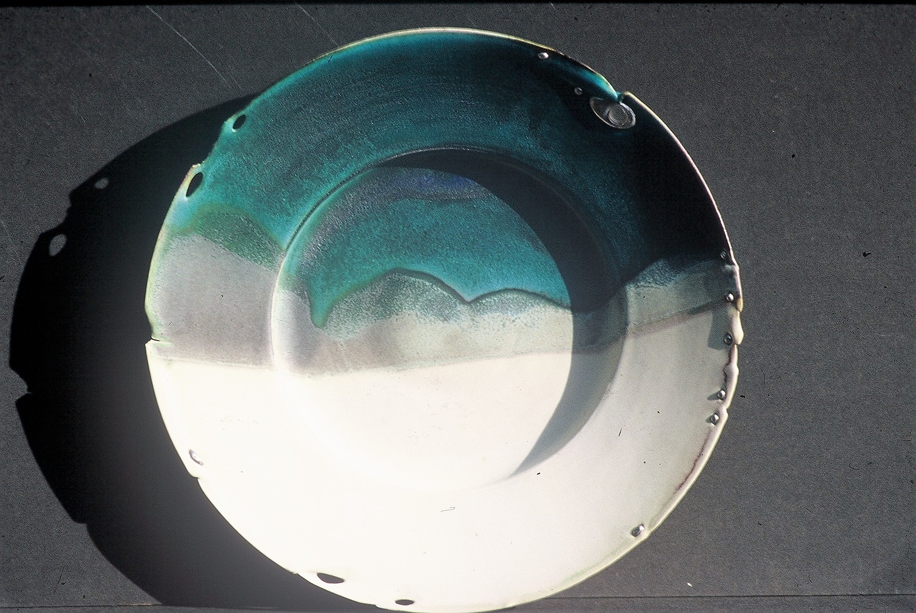 Valerie Metcalfe.1983. Landscape plate: “Prairie Winter” porcelain, solder, glass. 43.2 cm w.