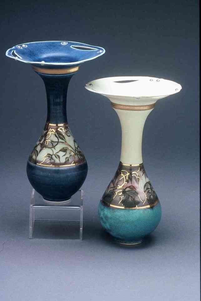 Valerie Metcalfe. 2005. Two Bud vases. Porcelain, solder and gold lustre. 17.8 cm h. (Thrown in one piece)