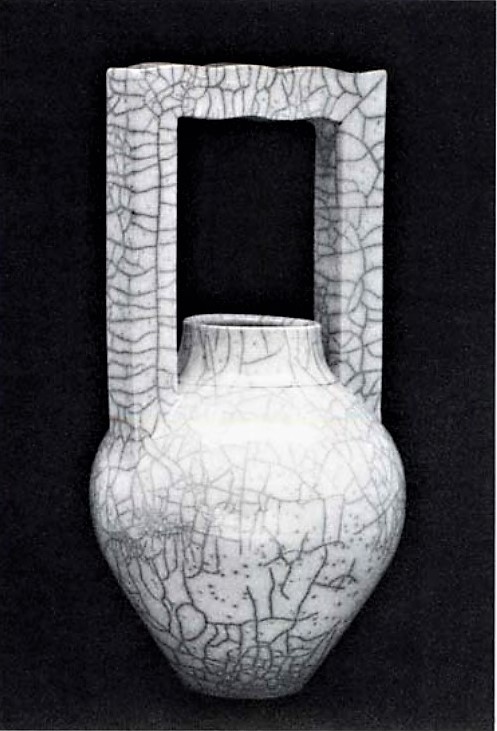 Peter Powning c.1986 Thrown raku pot with extruded handle. Reduced in sawdust. 48.3 cm.