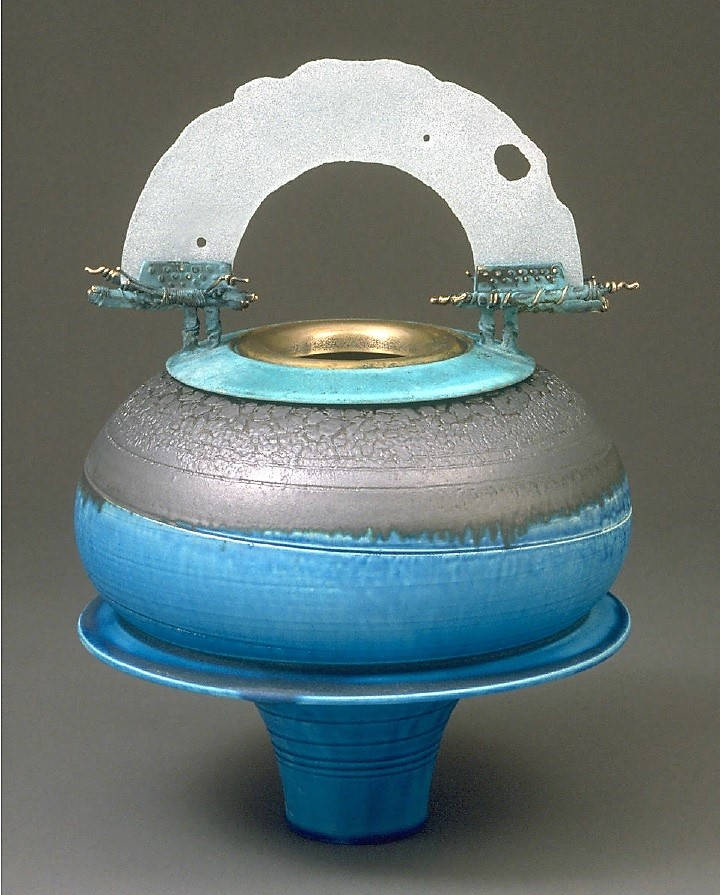 Peter Powning. Lunarium, 1996. 55.9 cm. tall. Thrown and assembled clay vase, C04, with a slumped glass arch and cast bronze rim and parts. Collection: the Art Gallery of Nova Scotia.