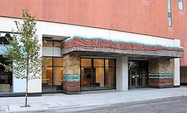 Peter Poening. Strata. Cinema Tower, 21 Widmer St., Toronto. 2013. 5.5 metres high x 18.3 metres wide x 4.3 metres deep. Pigmented and stained precast concrete, cast bronze, slumped glass, LED light array.