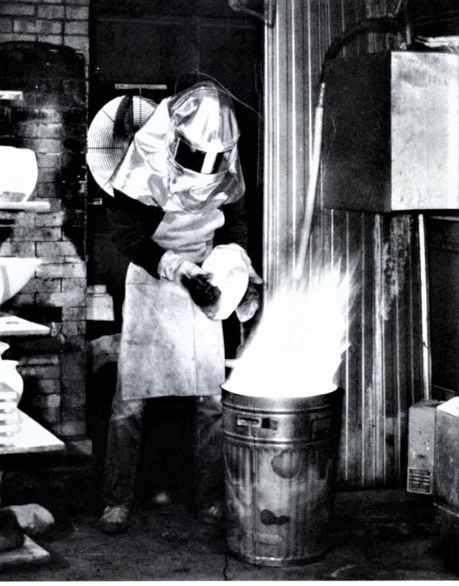 Peter Powning inside raku mask. Photo: Ceramics Monthly Nov '86.