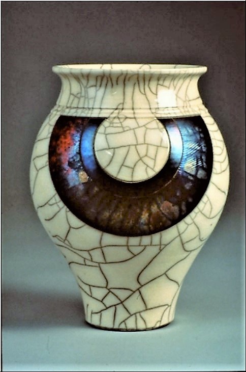 Peter Powning. 1992. Vase. Thrown. Raku with underglaze hard edge geometric shapes.
