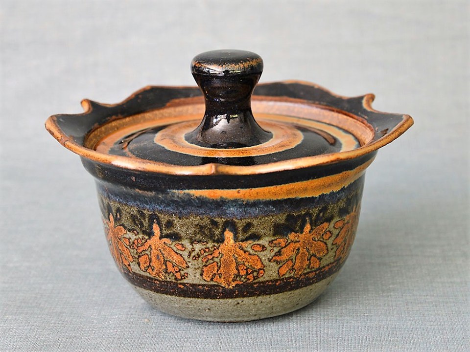 Donn Zver. 1985 Covered Casserole #2. 15.8 x 21.4 x 22.3 cm. Thrown stoneware, glaze with stamped decoration of iron and rutile oxide. Collection: Art Gallery of Burlington
