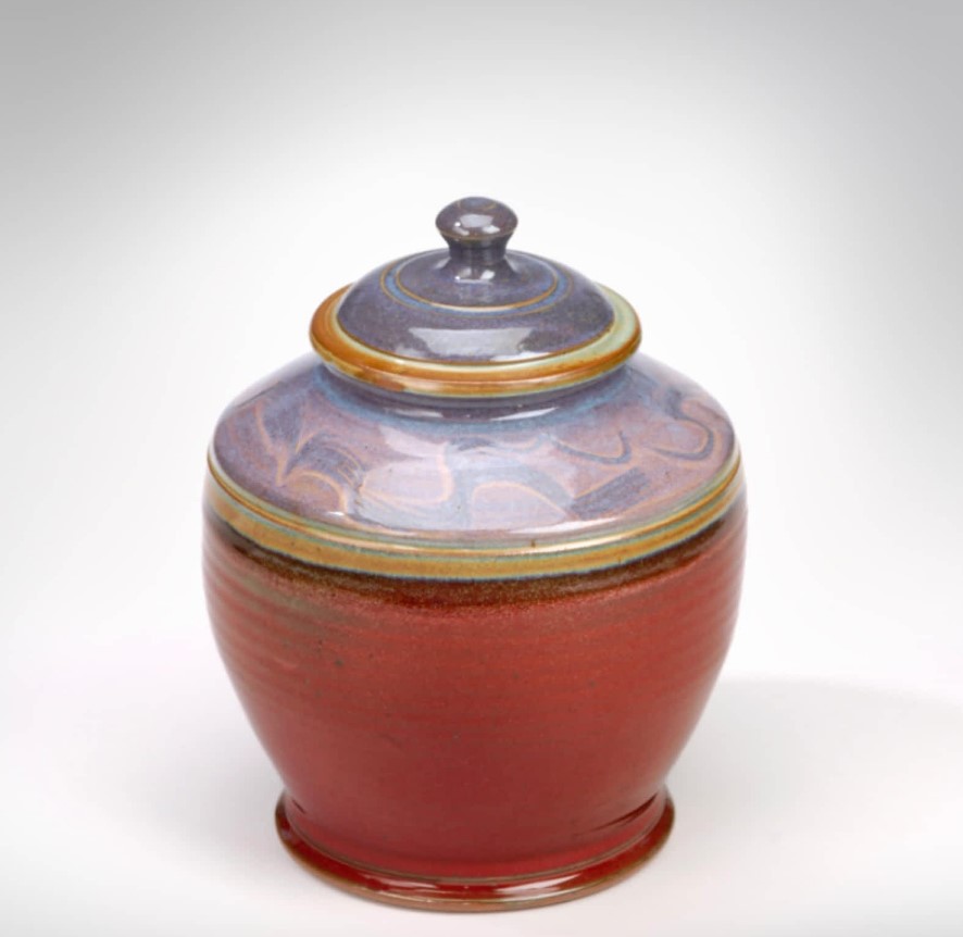 Donn Zver. 1985. Stoneware Jar. Copper red glaze with a opal blue top. 33 x 22.9 cm.