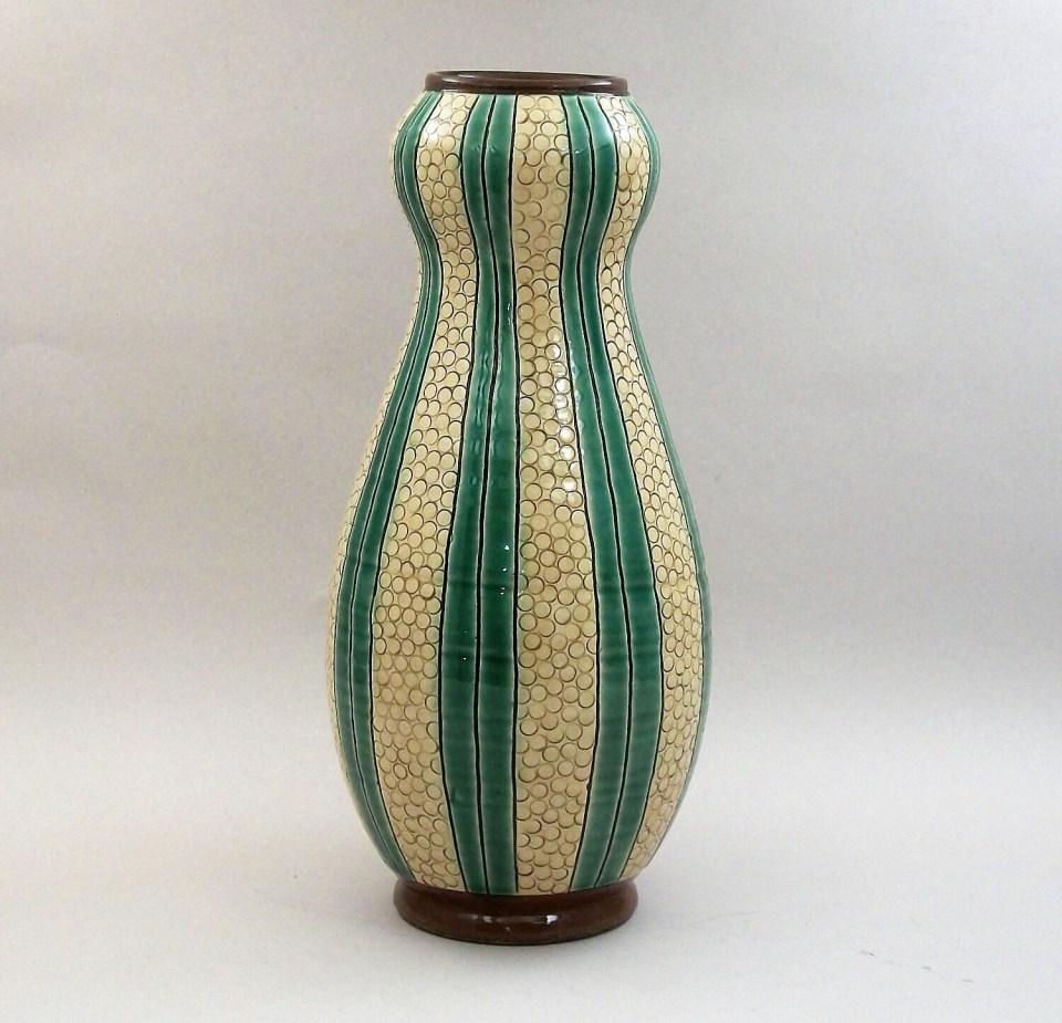 Birdsall-Worthington. 2020. Green and Yellow Double Gourd Vase. Earthenware. Sgaffito through white slip on brown clay; incised lines and circles. Alternating panels of yellow and green glazes. 24.8 cm.