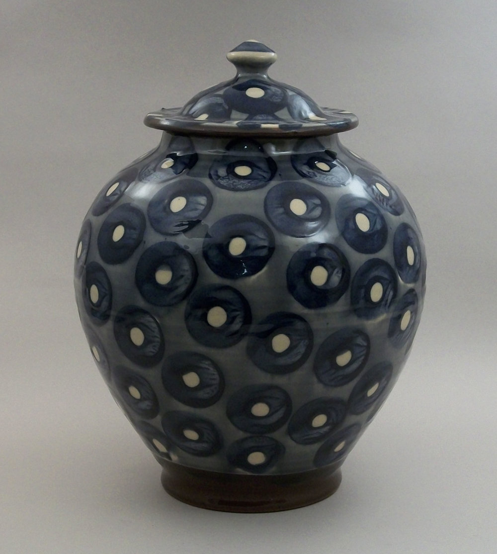 Birdsall Worthington. 2018. Lidded Jar. Hand thrown Lantz clay. Hand painted underglaze decoration on a white clay slip background, then covered with a pale transparent yellow glaze. 26.7 cm tall.