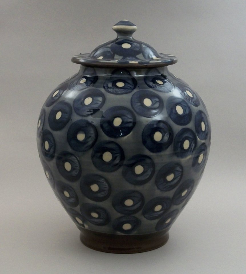 Birdsall Worthington. 2018. Lidded Jar. Hand thrown Lantz clay. Hand painted underglaze decoration on a white clay slip background, then covered with a pale transparent yellow glaze. 26.7 cm tall.
