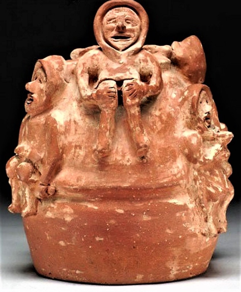 JOHN KAVIK. An unglazed ceramic vase decorated in high relief with Inuit figures. 33.00 cm. Photo: Katilvik.com