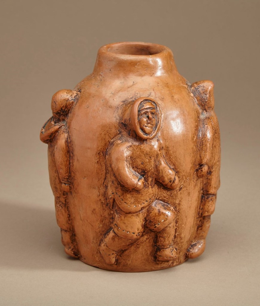 Lauret Aksadjuak. Rankin Inlet/Kkangiqliniq. c. 1968. Vase Decorated with Four Figures. Ceramic, signed in syllabics with disc number, c. 1968. 15.9 x 12.7 x 12.7 cm. Note: Clay and shoe polish were used to create this vessel.