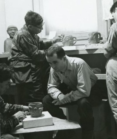 Claude Grenier with a group of potters in the pottery workshop. George Swinton fonds (WAG)