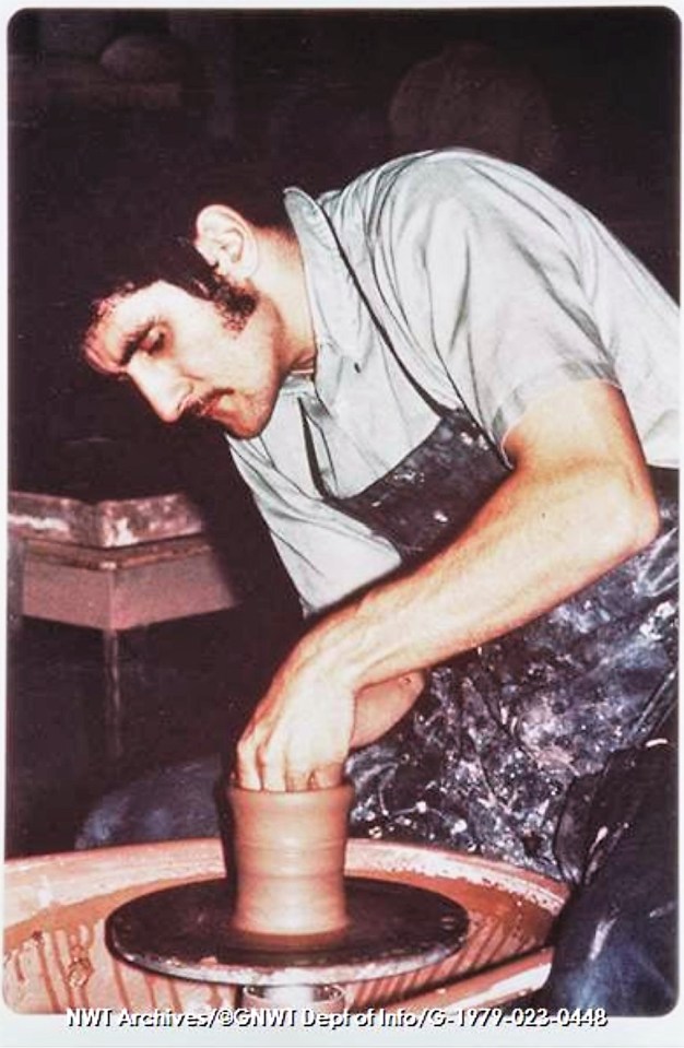 Robert Billyard. [Man works With pot on potter's wheel at Rankin Inlet pottery studio, ca.1971.] CREDIT: NWT Archives/Northwest Territories. Department of Information fonds/G-197g-023t 0448 From the holdings of the NWT Archives.