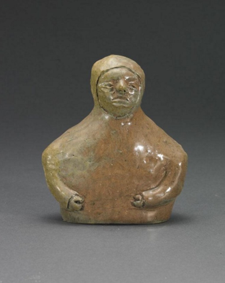 Eli Tikeayak.(1933-1996). E2-166, Rankin Inlet. Bust. ceramic, signed in syllabics. 16.5 x 14 x 6.4 cm.