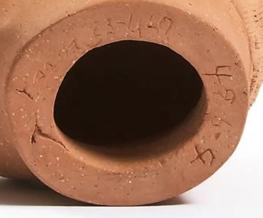 Donat Anawak. Signature and syllabics on the base of sculpture. . Photo: Mutual Art.