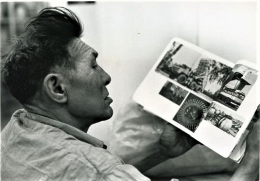 Patterk viewing art pictures as part of the pottery project. 1965. Photo: John Reeves. Winnipeg Art Gallery - George Swinton fonds