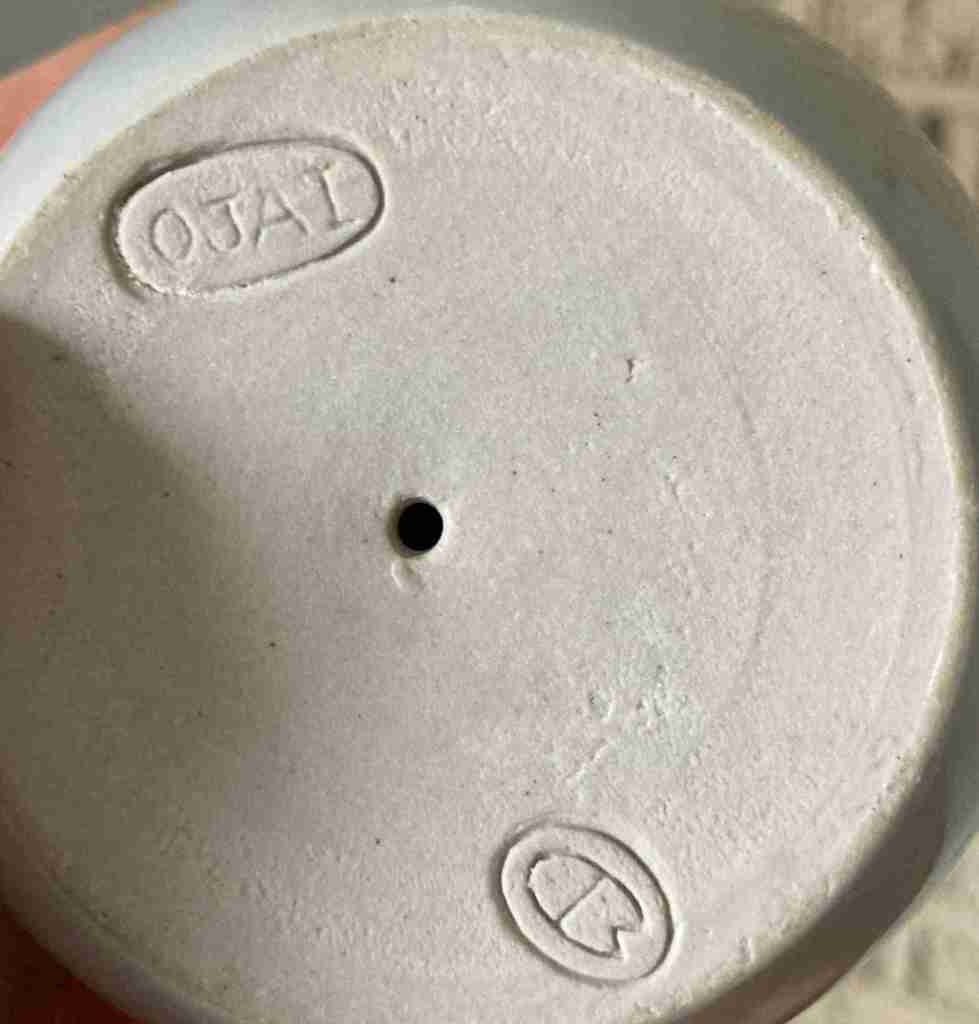 Dean Mullavey mark and OJAI stamp, undated. The OJAI stamp, possibly designed by Mullavey himelf, indicates a firing while visiting the Heinos in California and fired in their Beatrice Wood kiln.