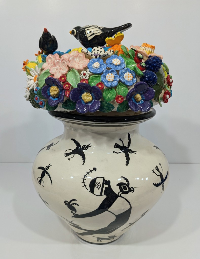 Judy Chartrand. Mimbres Ballet series, 2022 and on-going. Hand-coiled pot, hand modelled flowers and bird, underglaze, glaze. Sizes range approximately 30.5 dia x 61 – 71 cm tall, Rennie Collection. Photo: Blaine Campbell